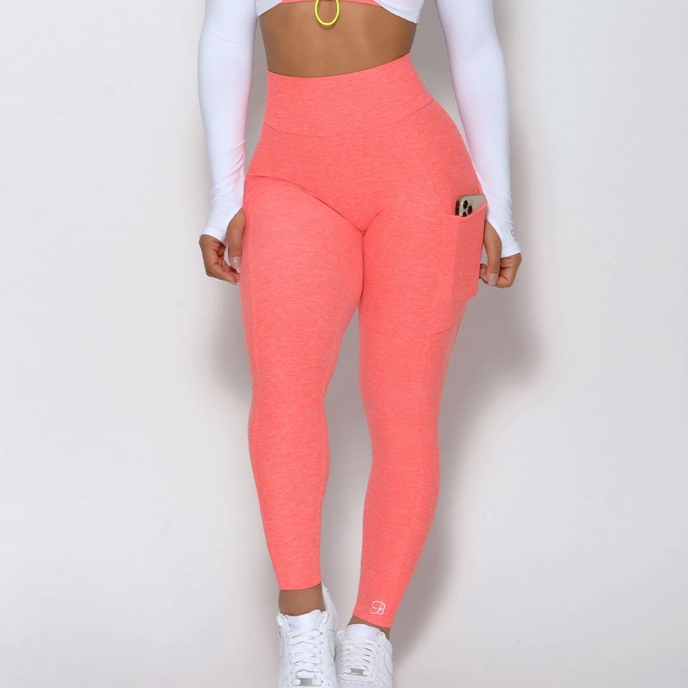 Bombshell curves leggings in the color coral gently worn eith pockets